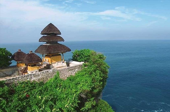The tiered meru roofs of Pura Luhur Uluwatu at the very edge of the cliff