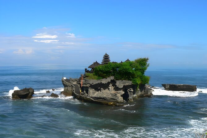 Tanah Lot on its offshore rock with the tide running around the base