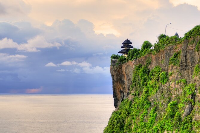 The headland at Uluwatu with the temple silhouetted on top of the cliff